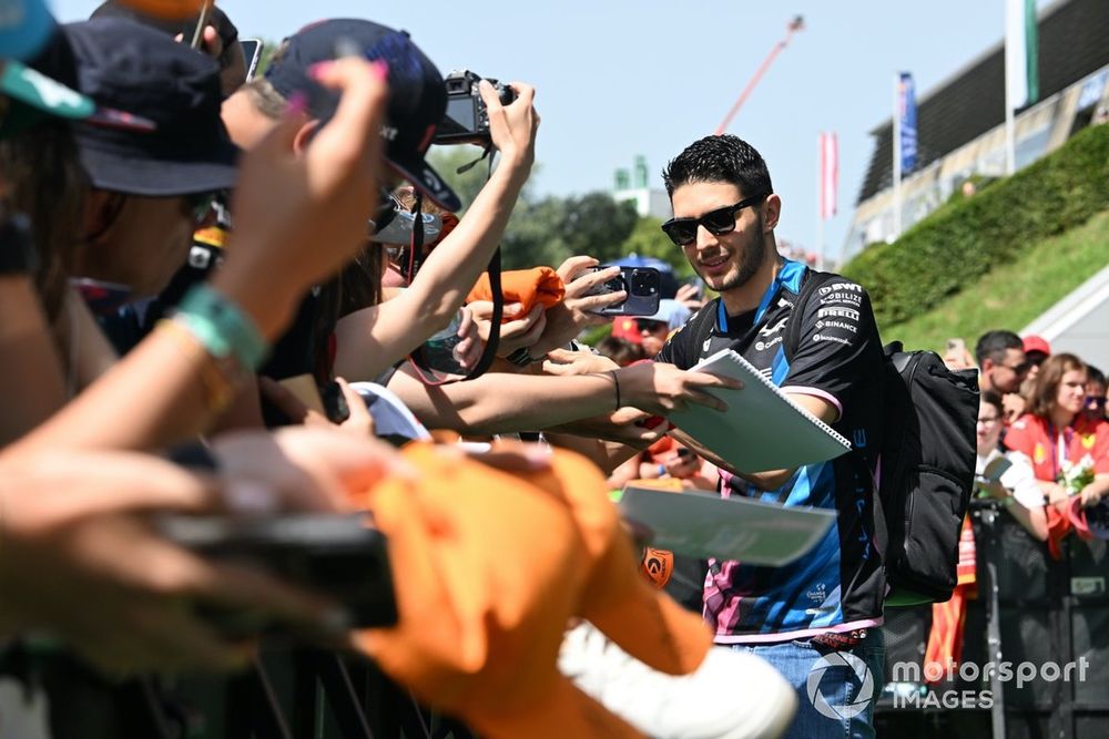 Esteban Ocon, Alpine F1 Team, signs autographs for fans