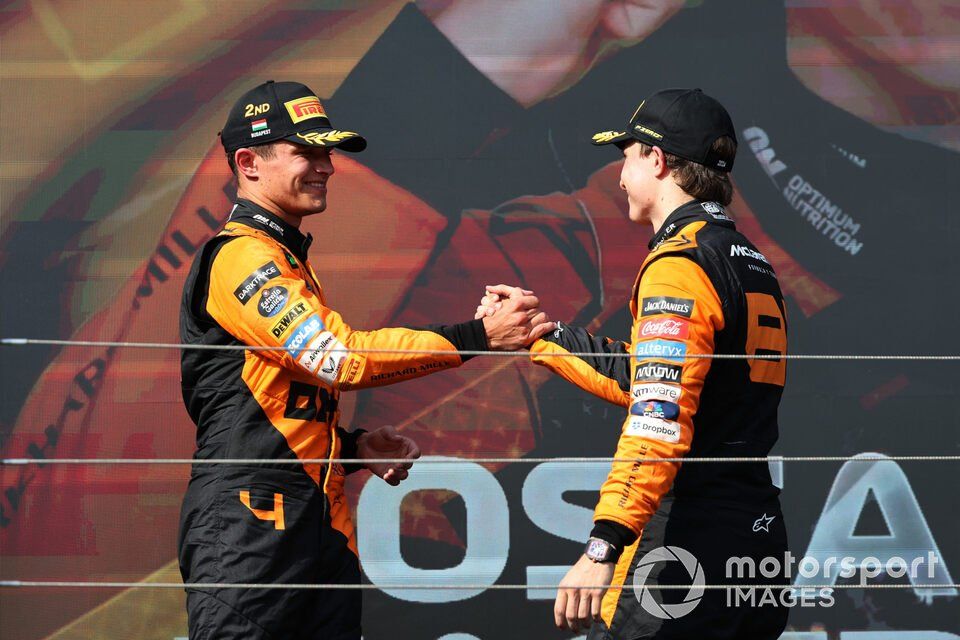 Lando Norris, McLaren F1 Team, 2nd position, Oscar Piastri, McLaren F1 Team, 1st position, congratulate each other on the podium