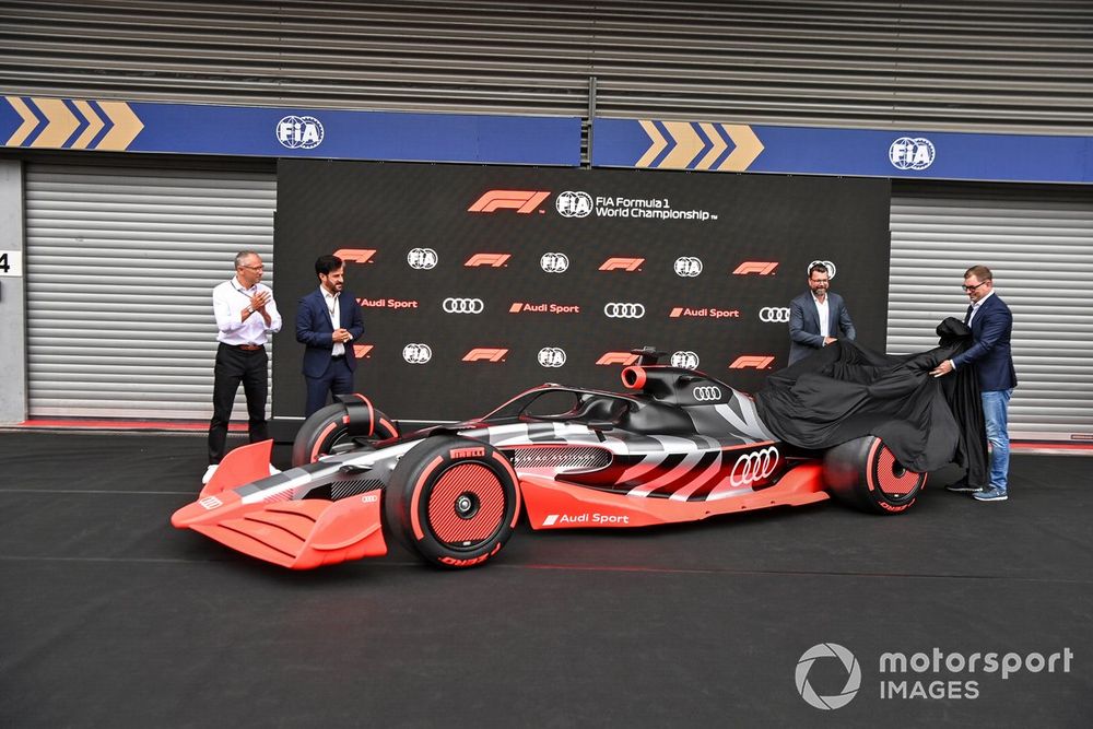 Stefano Domenicali, CEO, Formula 1, with Mohammed bin Sulayem, President, FIA, Oliver Hoffmann, Head of Technical Development at Audi Sport GmbH, Markus Duesmann, Chairman of the Board of Management of Audi AG showcase the new Audi Sport F1 concept car