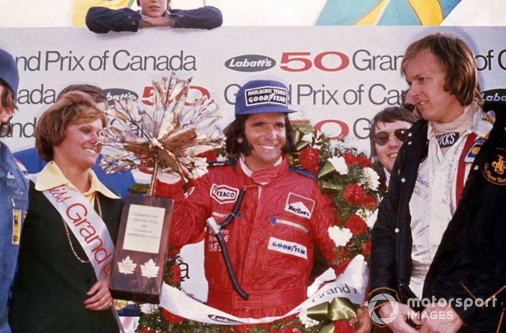 Emerson Fittipaldi celebrates with Ronnie Peterson