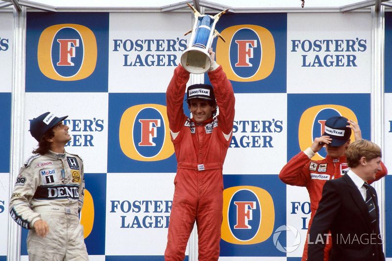 Podium: race winner and World Champion Alain Prost, second place Nelson Piquet, third place Stefan Johansson