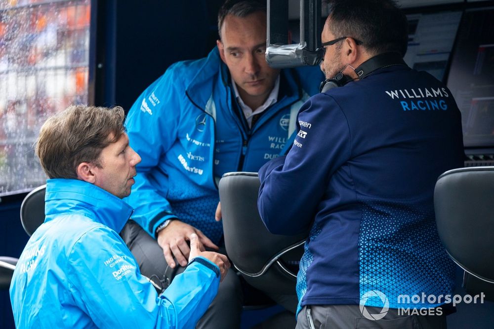 James Vowles, Team Principal, Williams Racing, speaks with teammates on the pit wall