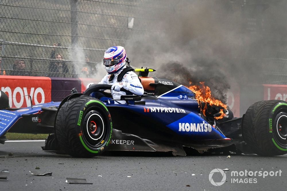 Logan Sargeant, Williams FW46, jumps out of his car after a crash