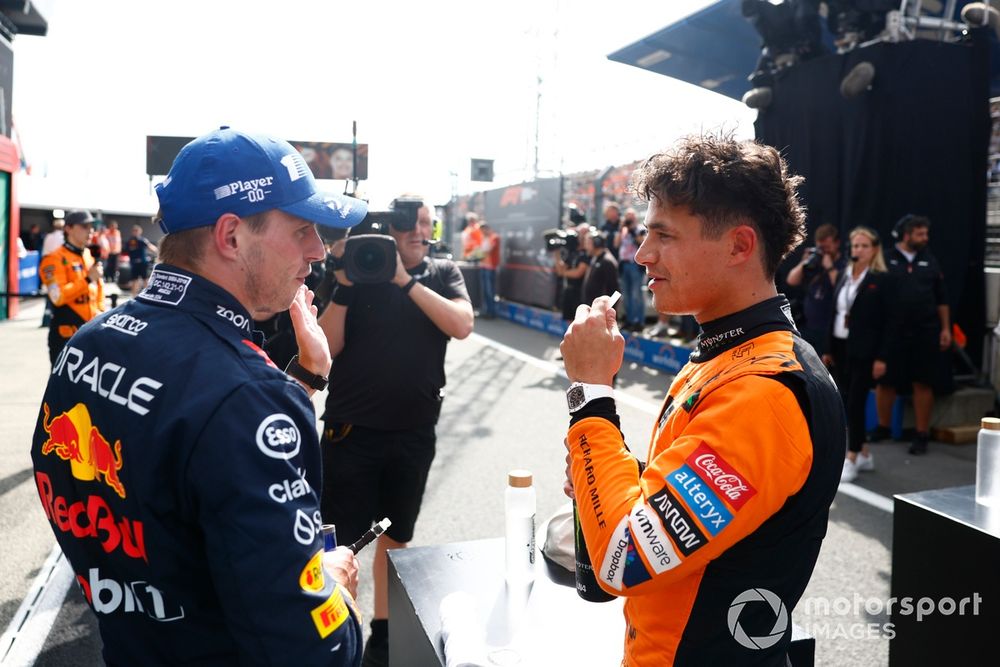 Pole man Lando Norris, McLaren F1 Team, debriefs with Max Verstappen, Red Bull Racing