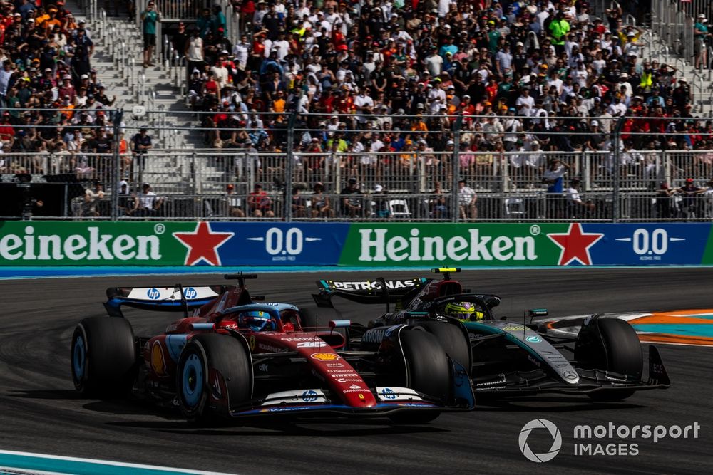 Sir Lewis Hamilton, Mercedes F1 W15, battles with Charles Leclerc, Ferrari SF-24