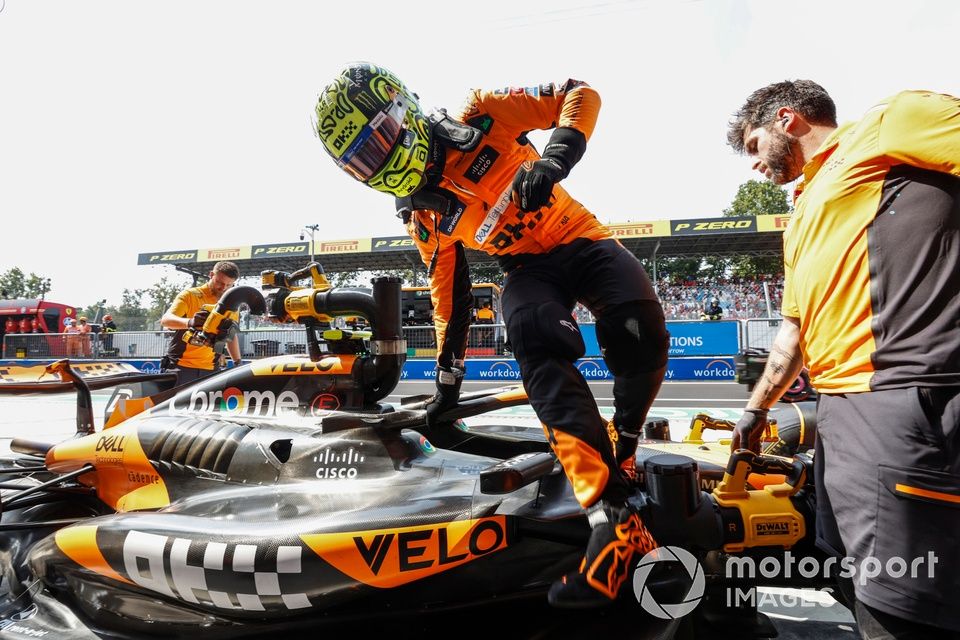 Lando Norris, McLaren F1 Team, gets out of the car in the pit lane 