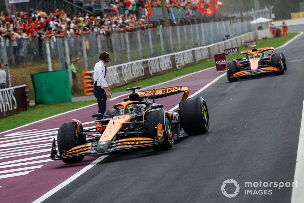 Oscar Piastri, McLaren MCL38, 2nd position, Lando Norris, McLaren MCL38, 3rd position, into Parc Ferme at the end of the race