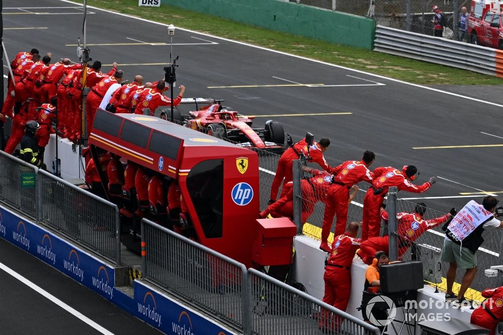 Team members of Scuderia Ferrari celebrate as Charles Leclerc, Ferrari SF-24, 1st position, crosses the finish line