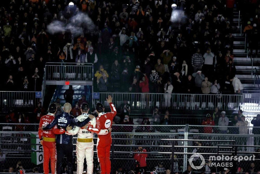 Sergio Perez, Red Bull Racing, 3rd position, the Red Bull trophy delegate, Max Verstappen, Red Bull Racing, 1st position, Charles Leclerc, Scuderia Ferrari, 2nd position, on the podium