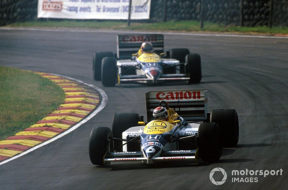 Nelson Piquet, Williams FW11 leads his team mate Nigel Mansell during an exciting race-long battle for the lead,
British Grand Prix, 1986