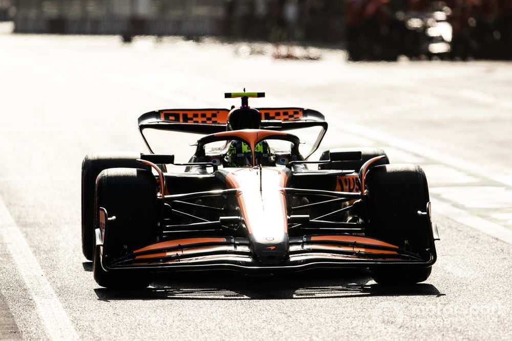 Lando Norris, McLaren MCL38, in the pit lane