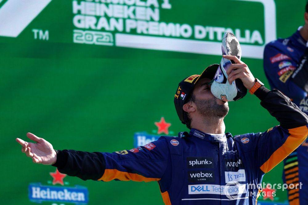 Daniel Ricciardo, McLaren, 1st position, performs a shoey on the podium