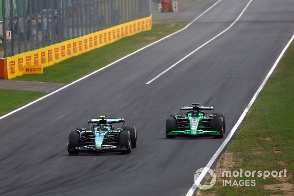 Valtteri Bottas, Stake F1 Team KICK Sauber C44 fights Fernando Alonso, Aston Martin AMR24 out of the pit lane 