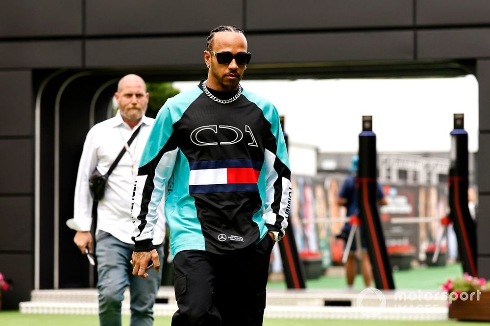 Lewis Hamilton wears Mercedes' Tommy Hilfiger collaboration designed by Clarence Ruth. 