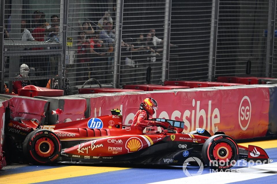 Carlos Sainz, Ferrari SF-24, climbs out of his damaged car after a crash in Qualifying