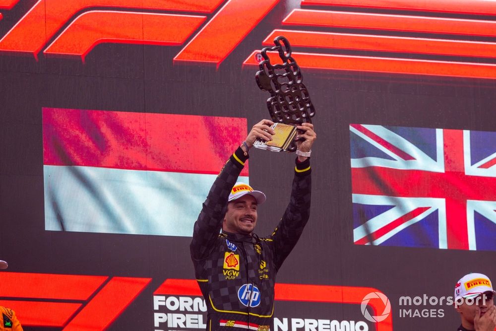 Charles Leclerc, Scuderia Ferrari, 1st position, lifts the winners trophy