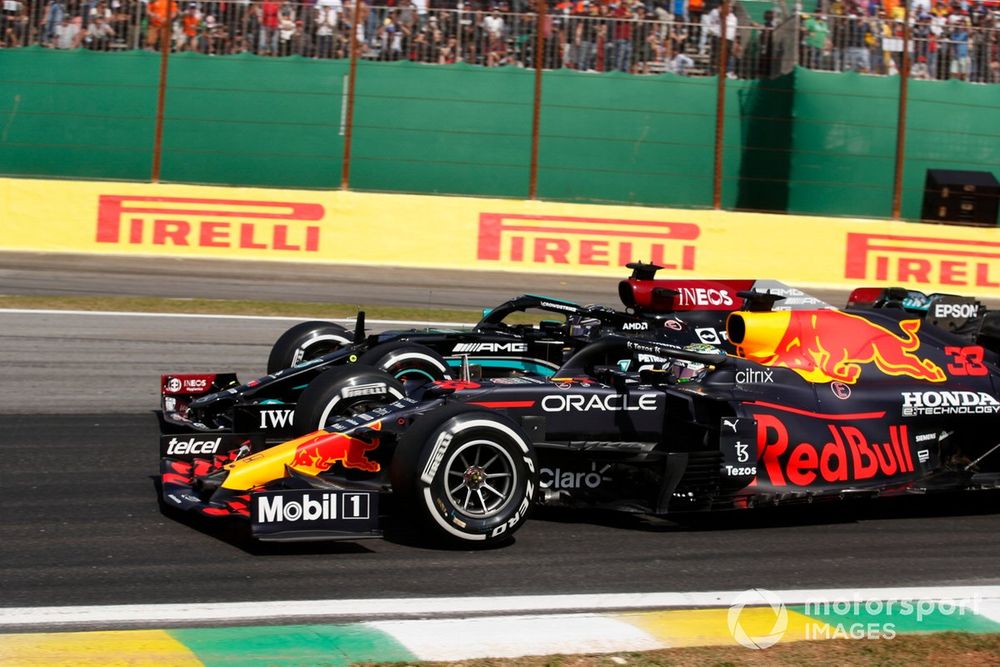 Max Verstappen, Red Bull Racing RB16B, battles with Lewis Hamilton, Mercedes W12