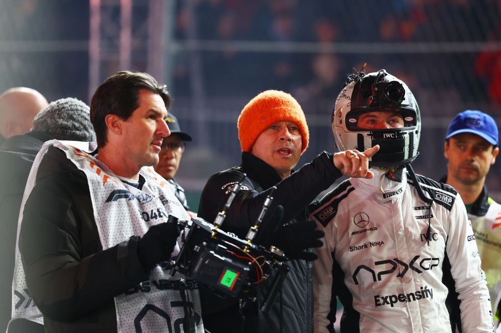 Actor Brad Pitt, with director Joseph Kosinski look onto parc ferme during qualifying ahead of the Las Vegas Grand Prix, filming for the upcoming 