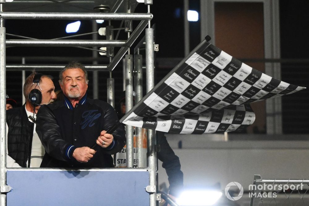 Sylvester Stallone waves the chequered flag