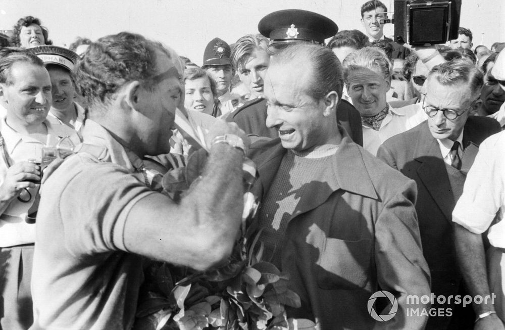 Juan Manuel Fangio, Mercedes,  congratulates  Stirling Moss, Mercedes