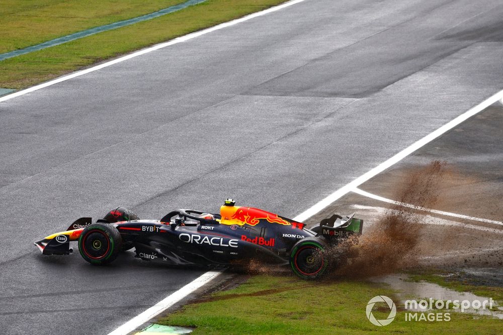 Sergio Perez, Red Bull Racing RB20, sprays mud as he tries to rejoin after a spin