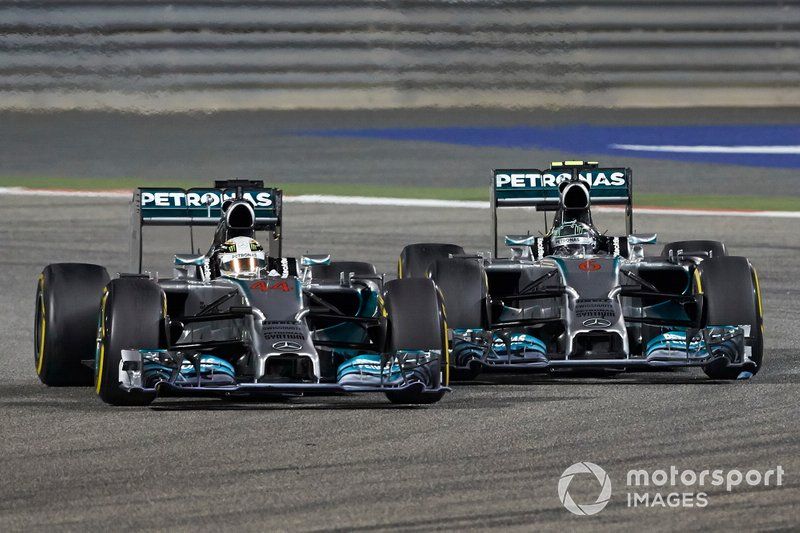 Lewis Hamilton, Mercedes W05, battles with Nico Rosberg, Mercedes W05 