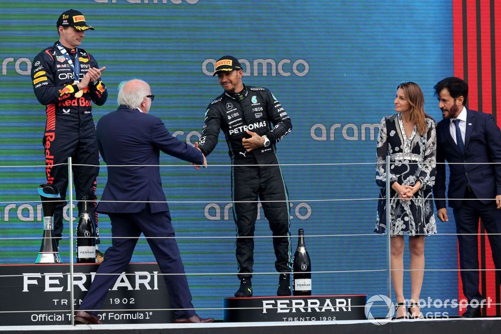 Lewis Hamilton, Mercedes-AMG, 3rd position, is congratulated by David Richards on the podium