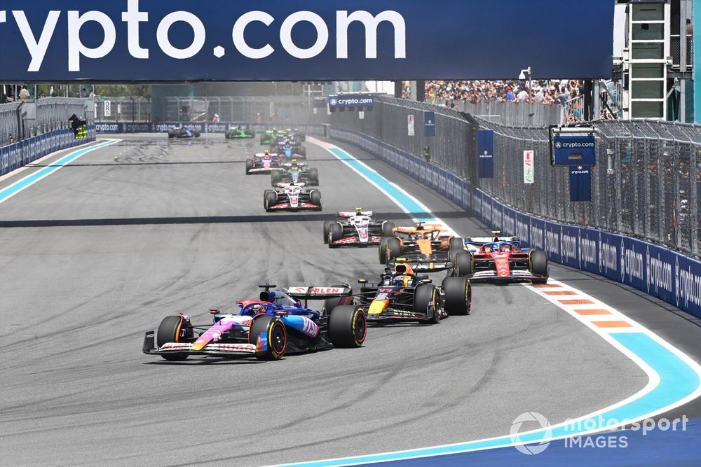 Daniel Ricciardo, VCARB 01, leads Sergio Perez, Red Bull Racing RB20, and Carlos Sainz, Ferrari SF-24