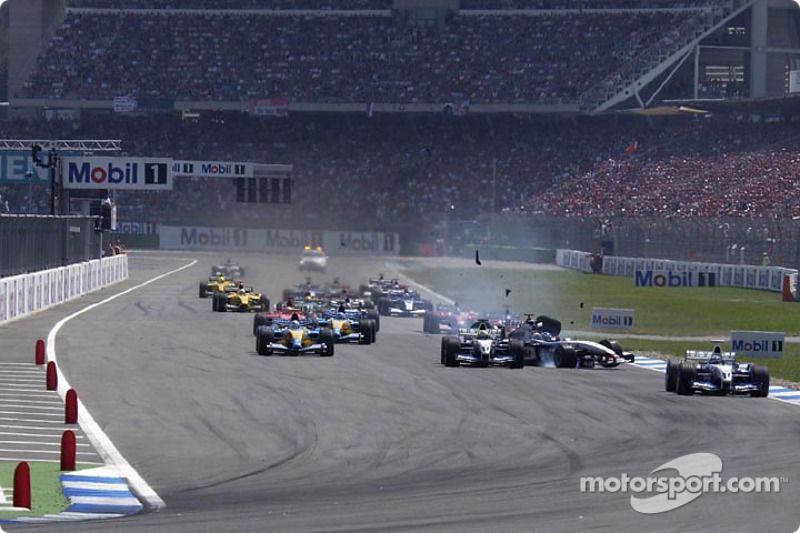 Juan Pablo Montoya in the lead while Ralf Schumacher collides with Kimi Raikkonen at the 2003 German GP.