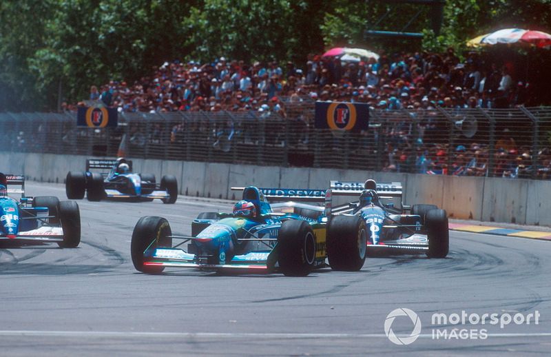 Michael Schumacher, Benetton B194 leads with Damon Hill, Williams FW16B